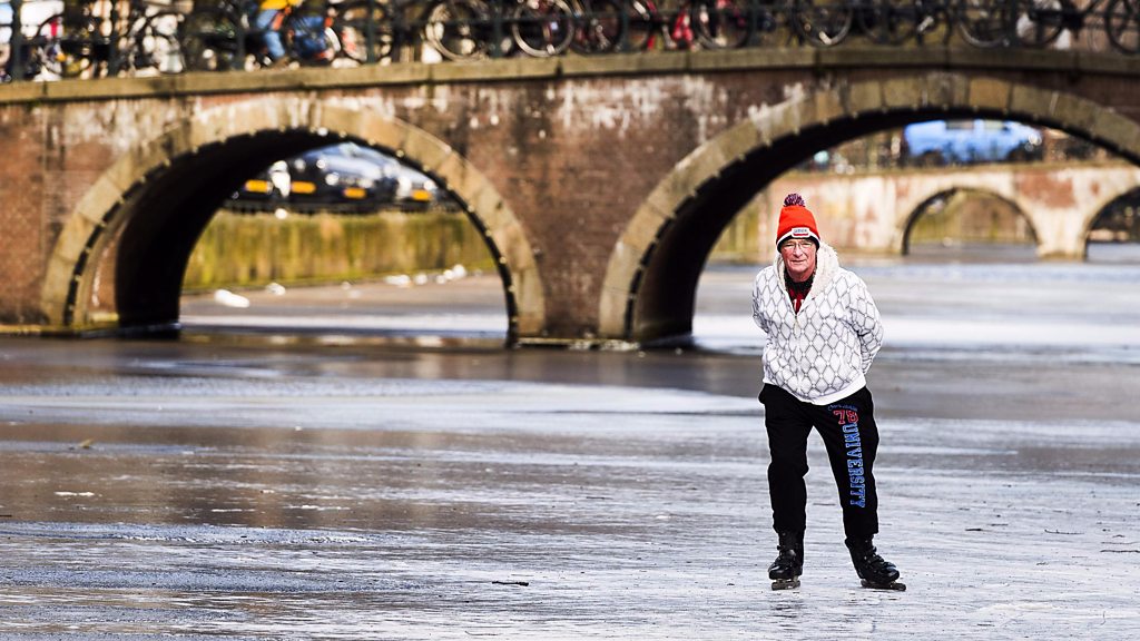 Ice skating fun breaks out on Dutch canals
