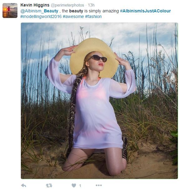 Albino model posing on beach