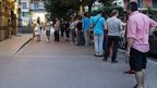 Greeks queue for cash outside an ATM in Thessaloniki