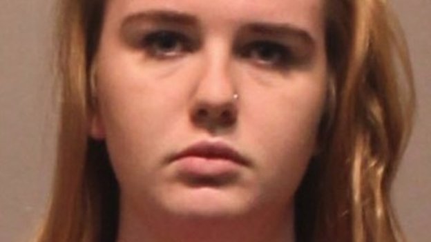 US student charged over smearing body fluids