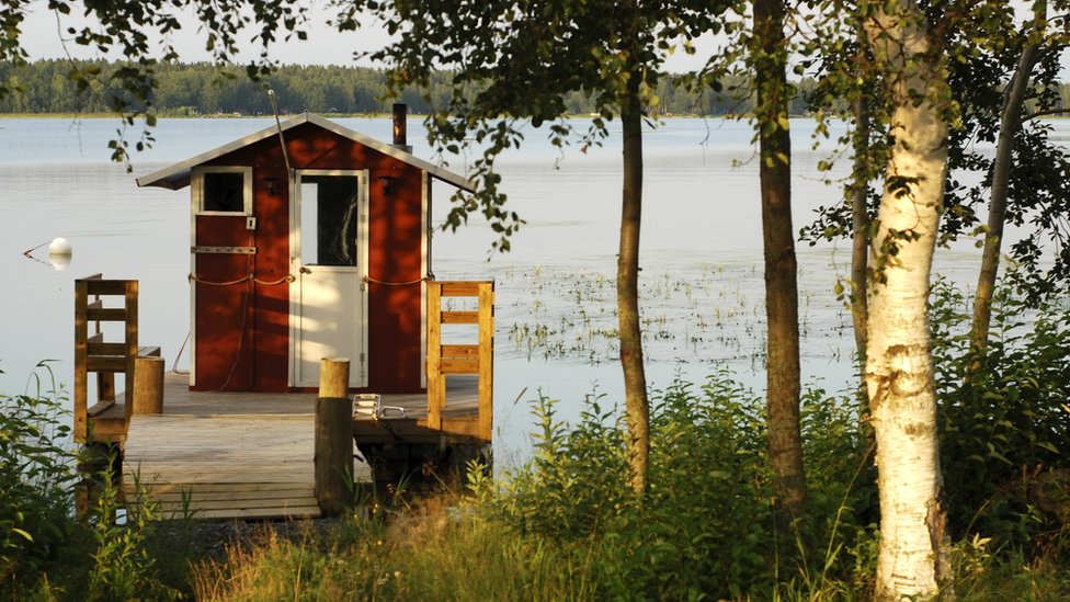 A Finnish sauna hut on a lake