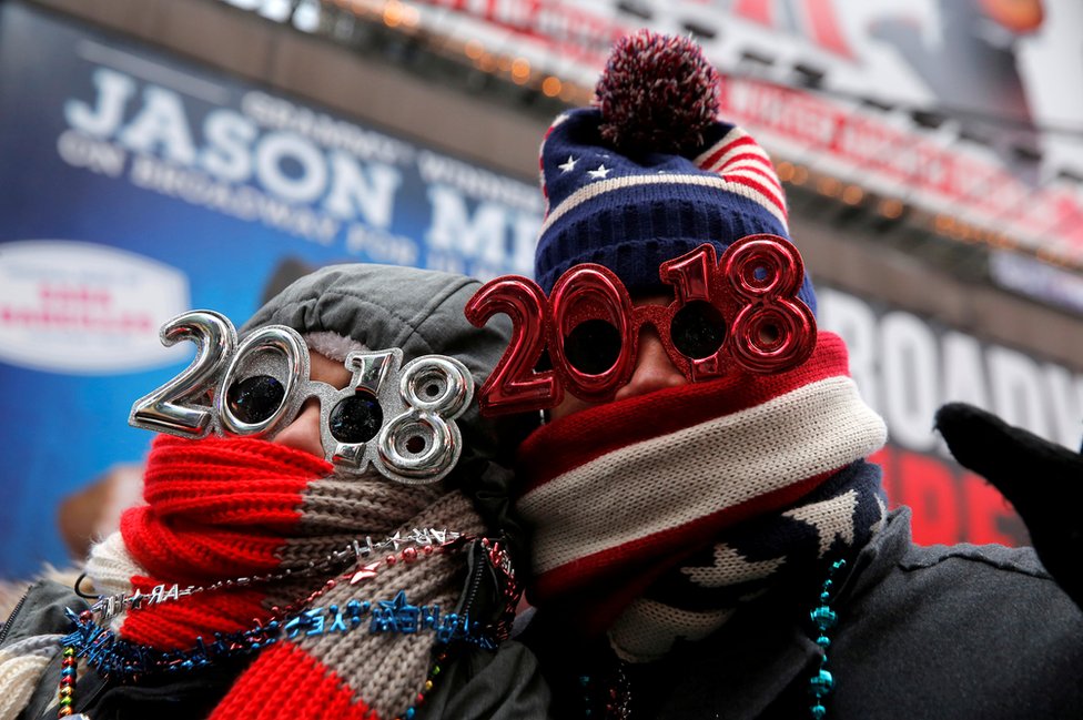 Revelers gather in Times Square as a cold weather front hits the region ahead of New Year"s celebrations in Manhattan, New York, U.S., December 31, 2017.