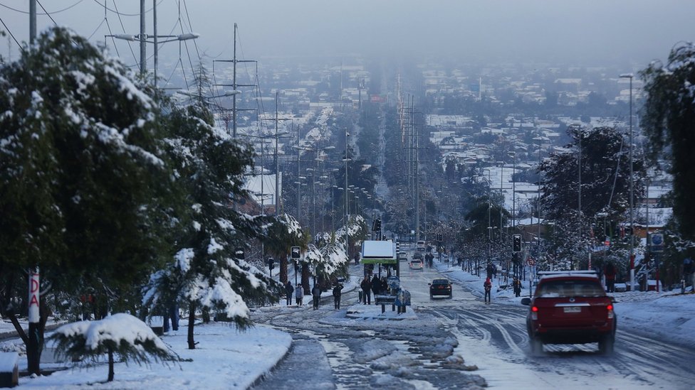 Rare snowfall blankets Santiago