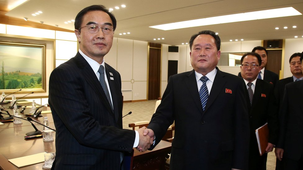 Head of the North Korean delegation, Ri Son Gwon shakes hands with South Korean counterpart Cho Myoung-gyon after their meeting at the truce village of Panmunjom in the demilitarised zone