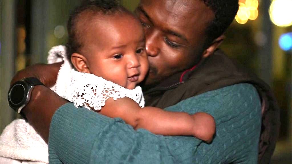 Baby meets father for first time after Sudan escape