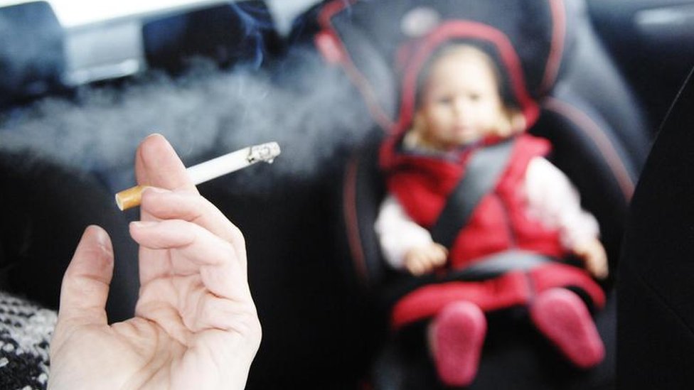 child smoking cigarettes Is a Big Tobacco Company Profiting From Kids? Boy with cigarettes | Stock