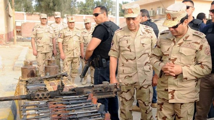 Egypt"s President Abdel Fattah al-Sisi (R) inspects weapons taken from Islamist militants after travelling to inspect the Egyptian armed forces in the troubled northern part of the Sinai peninsula in this July 4, 2015 handout photo by the Egyptian Presidency
