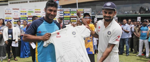 Kumar Sangakkara was presented with a signed shirt by India captain Virat Kohli