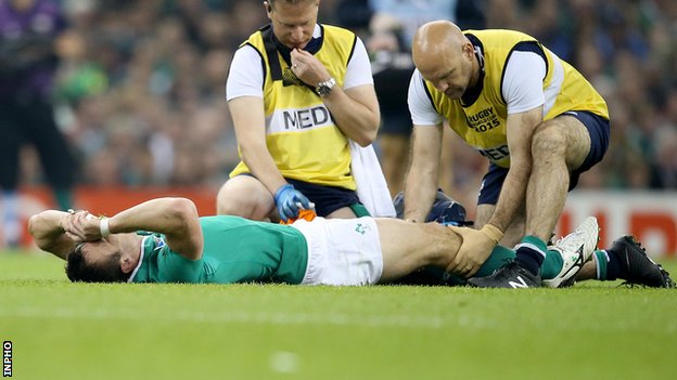 Tommy Bowe receives treatment after sustaining the knee injury