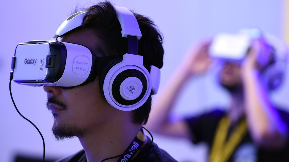People playing with GearVR Oculus headsets
