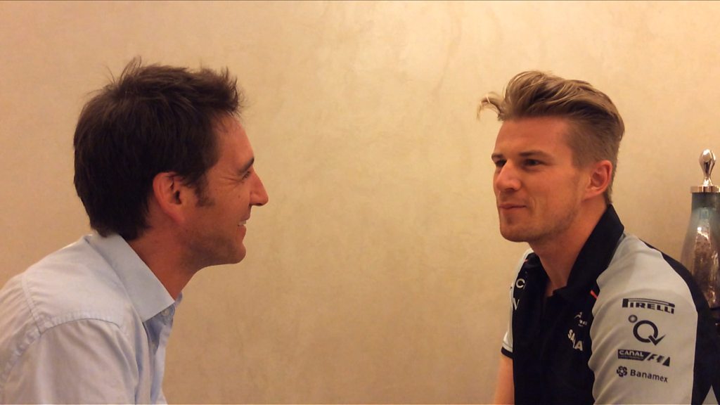 Force India driver Nico Hulkenberg gets up close and personal with Tom Clarkson