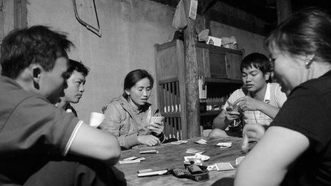 Photo of people playing cards