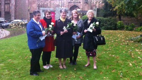 Photo of Jennifer with the remaining family members of the victims