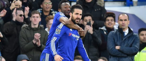 Cesc Fabregas celebrates scoring against Everton