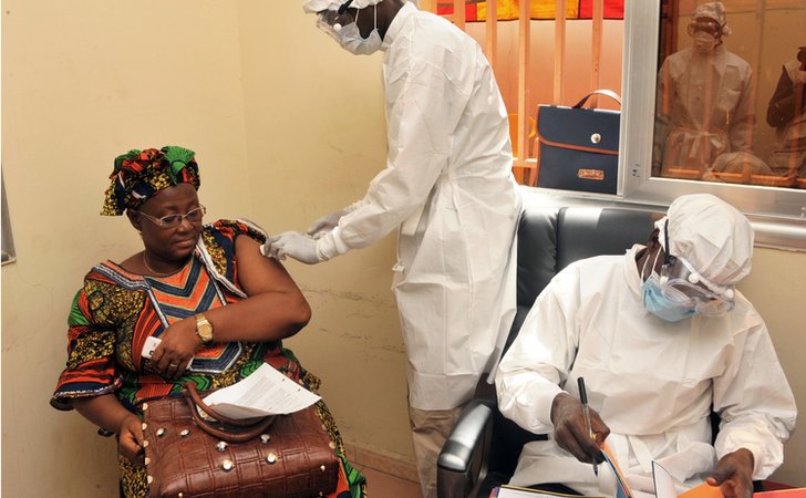 A woman gets vaccinated on 10 March 2015 at a health centre in Conakry during the first clinical trials of the VSV-EBOV vaccine against the Ebola virus