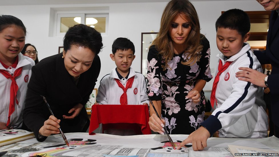 First Lady Peng Liyuan and First Lady Melania Trump paint a panda with school children