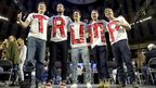 Trump supporters wear T-shirts with his name on at a rally in Lynchburg, Virginia