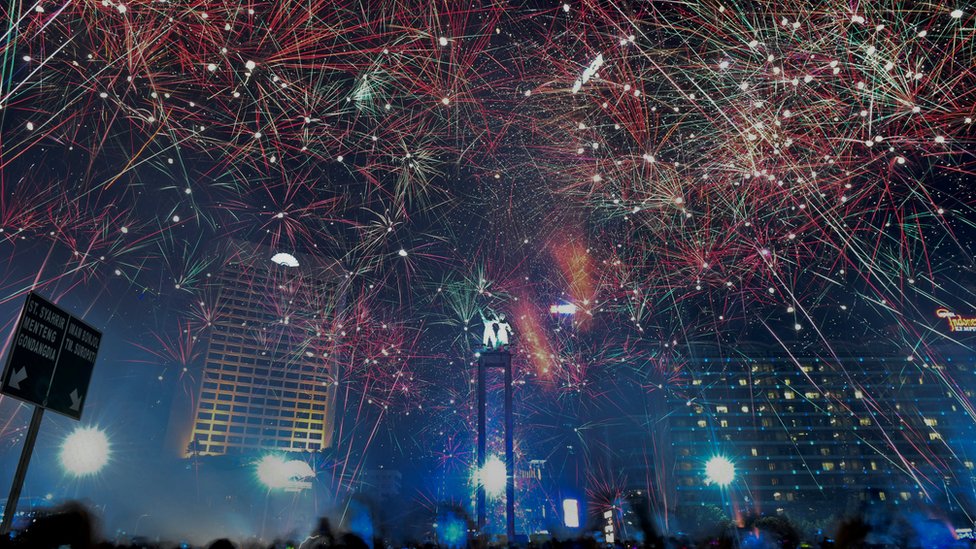 Fireworks explode during New Year's celebrations in the business district in Jakarta, Indonesia January 1, 2018 in this photo taken by Antara Foto.