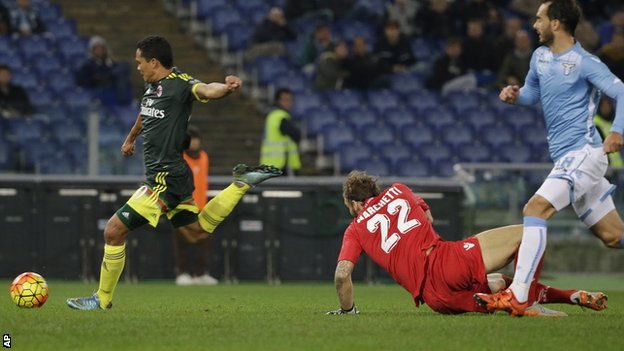 Carlos Bacca scores AC Milan's third goal in a 3-1 win at Lazio