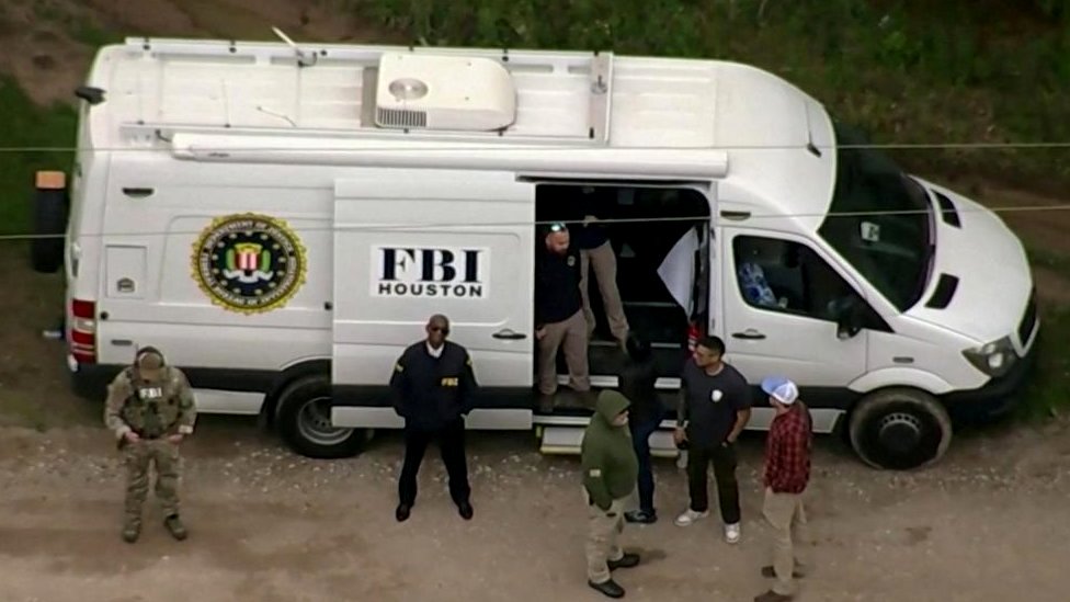 FBI hunt 'armed and dangerous' shooting suspect