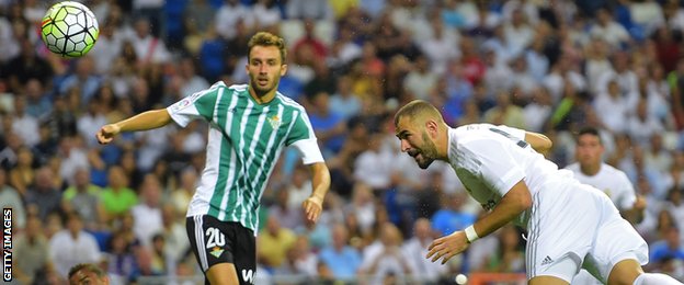Karim Benzema heads a goal for Real Madrid
