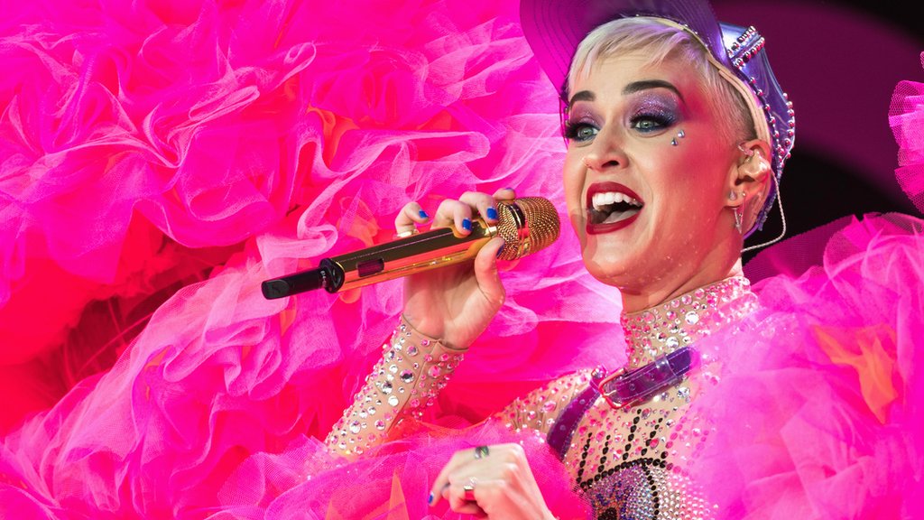 Katy Perry crowdsurfs at Glastonbury.