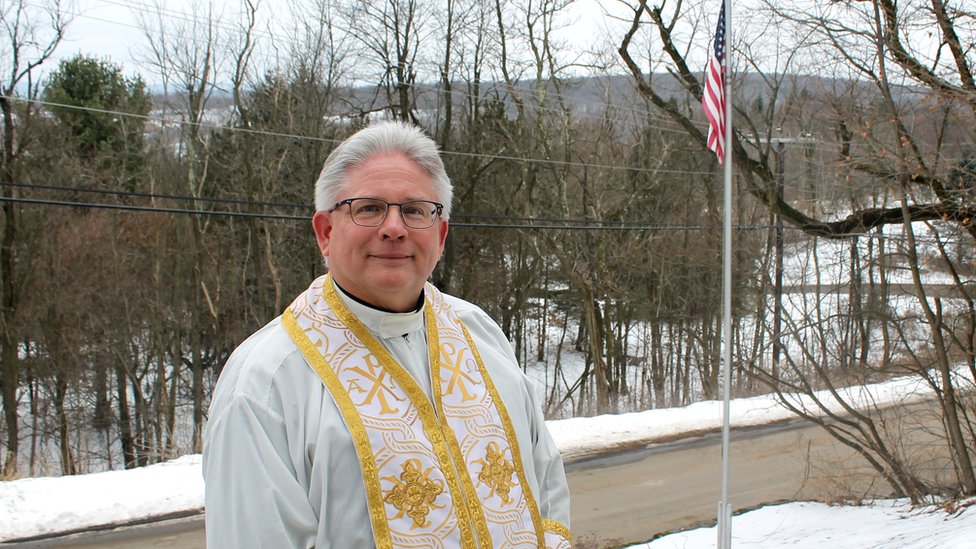 Father Michael Hutsko outside the Assumption of the Blessed Virgin Mary Ukrainian Catholic Church in Centralia