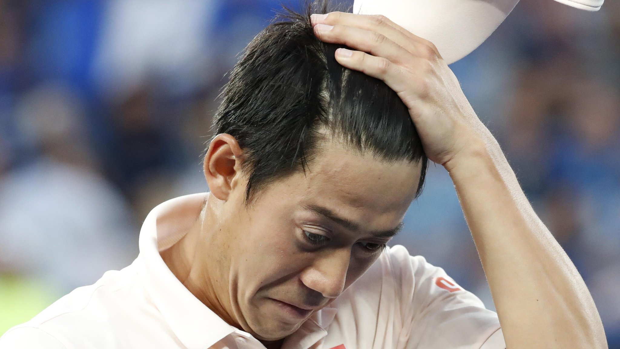 Djokovic into Australian Open semis as Nishikori quits