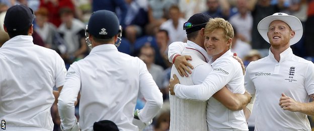 Joe Root (second from right) celebrates a wicket with team-mates