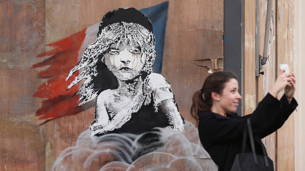 Banksy's Calais 'Jungle' teargas mural boarded up by building firm
