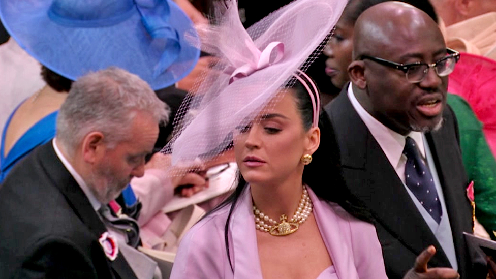 Katy Perry searches for her seat at Coronation