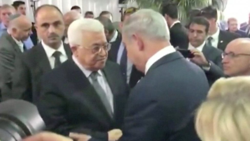 Palestinian and Israeli leaders shake hands at Peres funeral