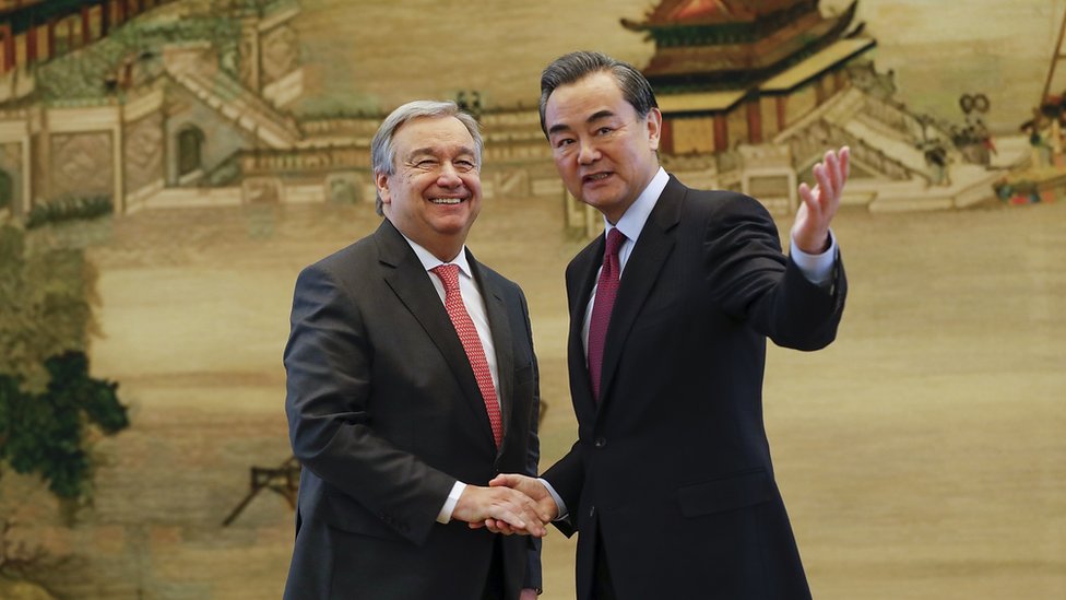 Chinese Foreign Minister Wang Yi (R) shakes hands with United Nations Secretary General-designate Antonio Guterres after a joint press conference at the foreign ministry on November 28, 2016 in Beijing, China
