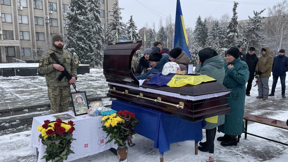 Funeral held for battleground body collector in Ukraine