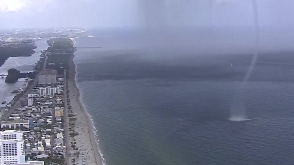 Waterspout crashes on to beach full of people in Miami