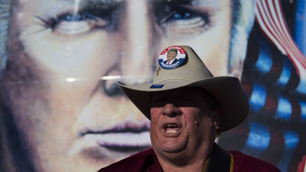 Trump supporter in Stetson, adorned with a "Trump for president" badge