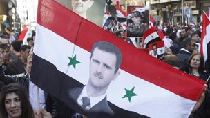Flag with portrait of Bashar al-Assad (file photo)
