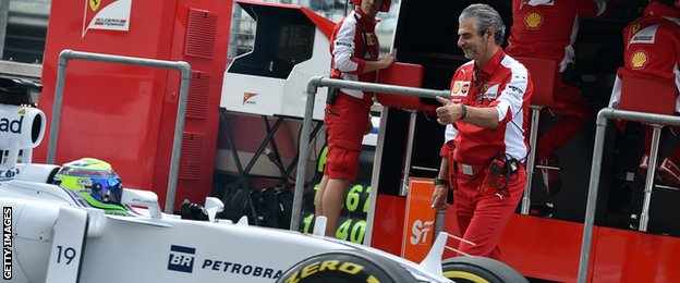 Arrivabene gives a thumbs-up to Massa in the pits shortly afterwards