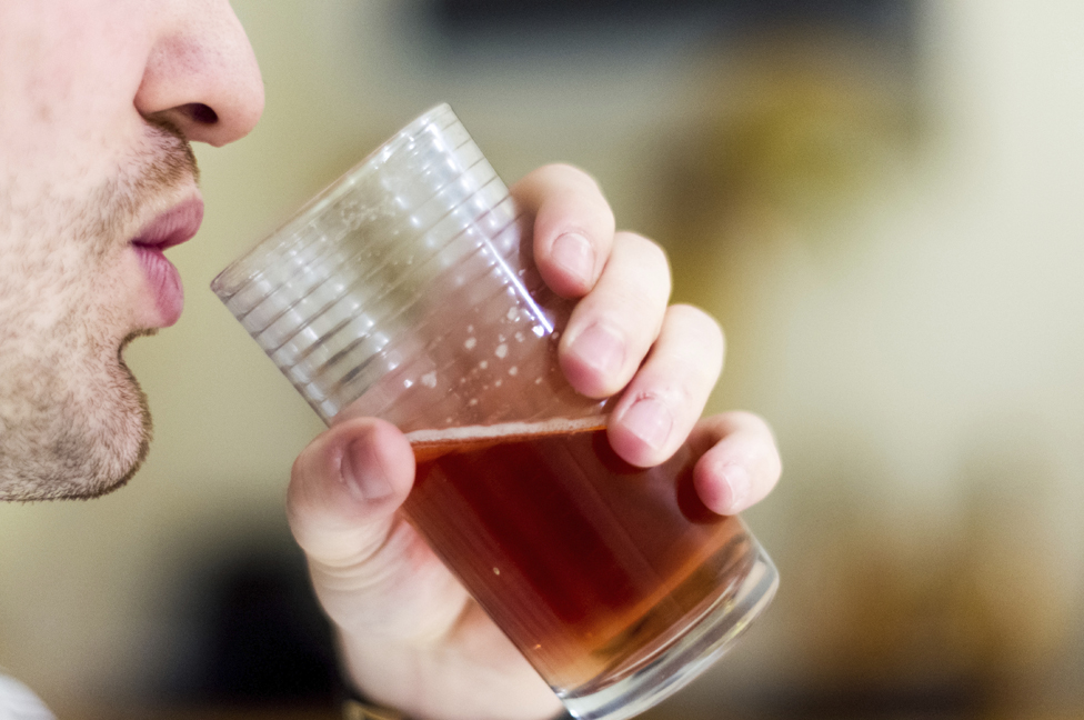 Man drinking ale