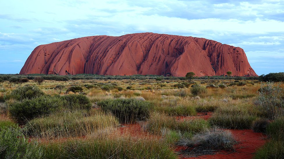 Three Australian men rescued from Uluru after 11-hour operation