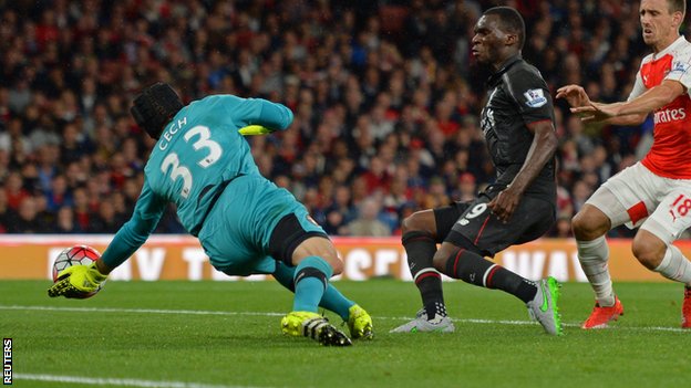 Arsenal keeper Petr Cech saves from Liverpool striker Christian Benteke