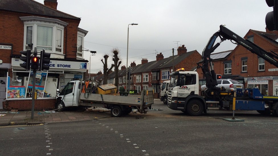 Lorry in front of shop