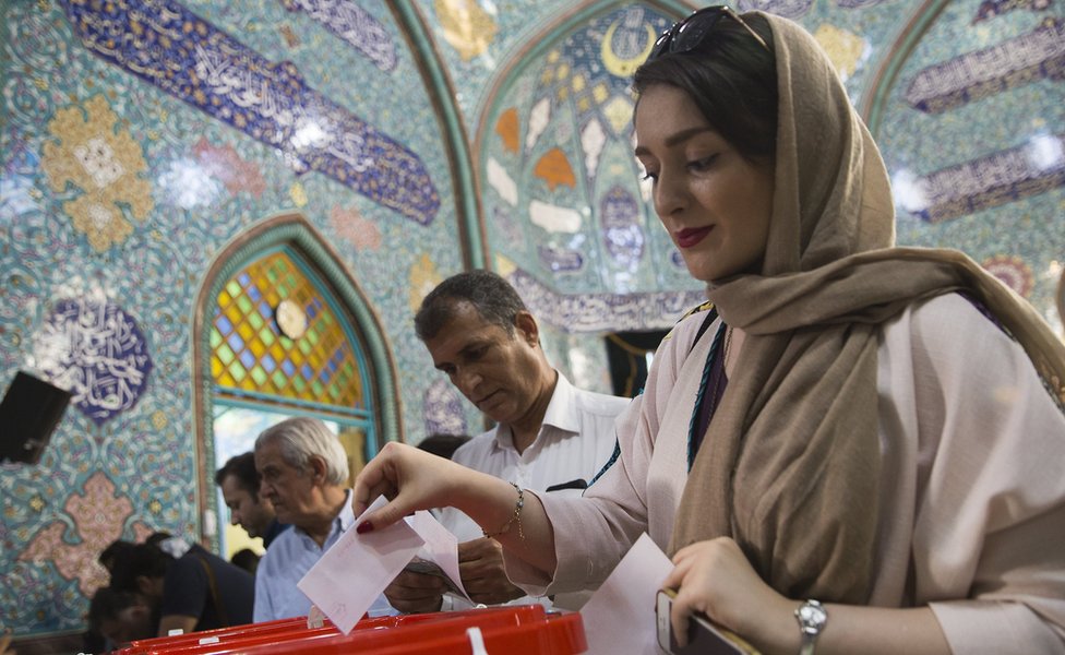 Iranian voters cast their ballots for the presidential and municipal council election on May 19, 2017 in the city of Qom, south of the capital Tehran, Iran