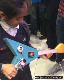 School Reporter trying out a Micro Bit guitar