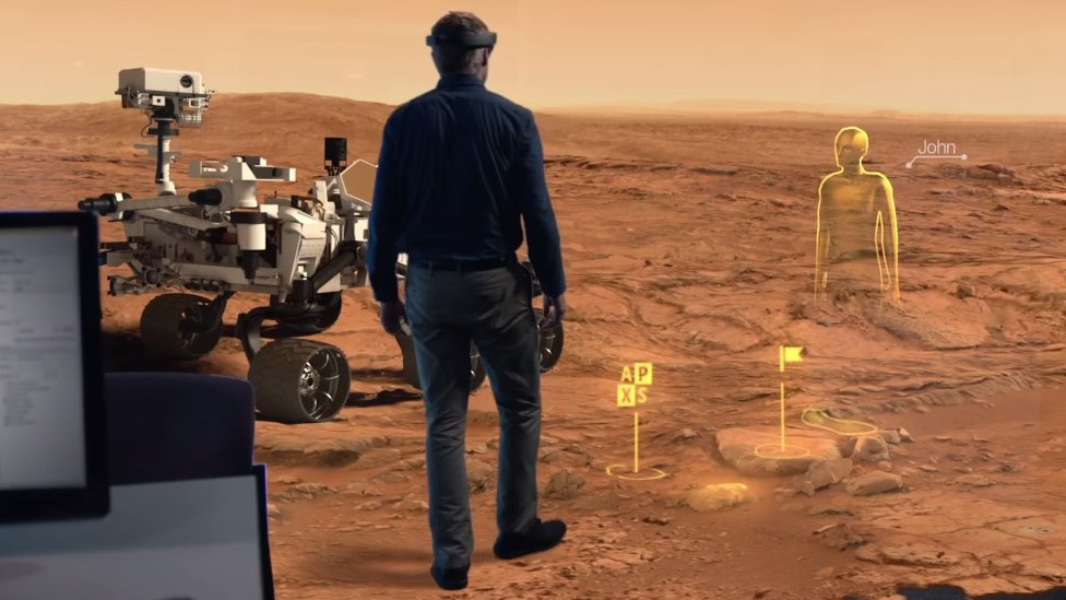 Screengrab of video showing man interacting with Mars surface