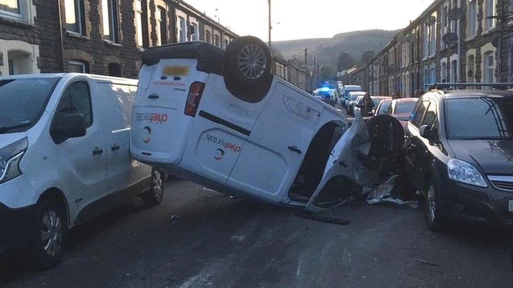 Driver arrested after crash leaves van on its roof