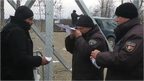 Border official check migrant's papers at Greece Macedonia border