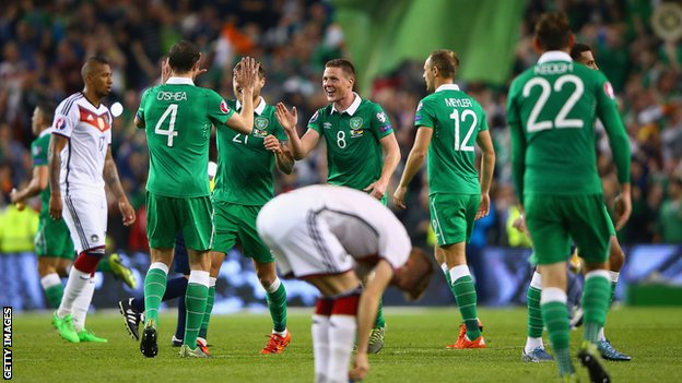 Republic of Ireland players celebrate scoring against Germany
