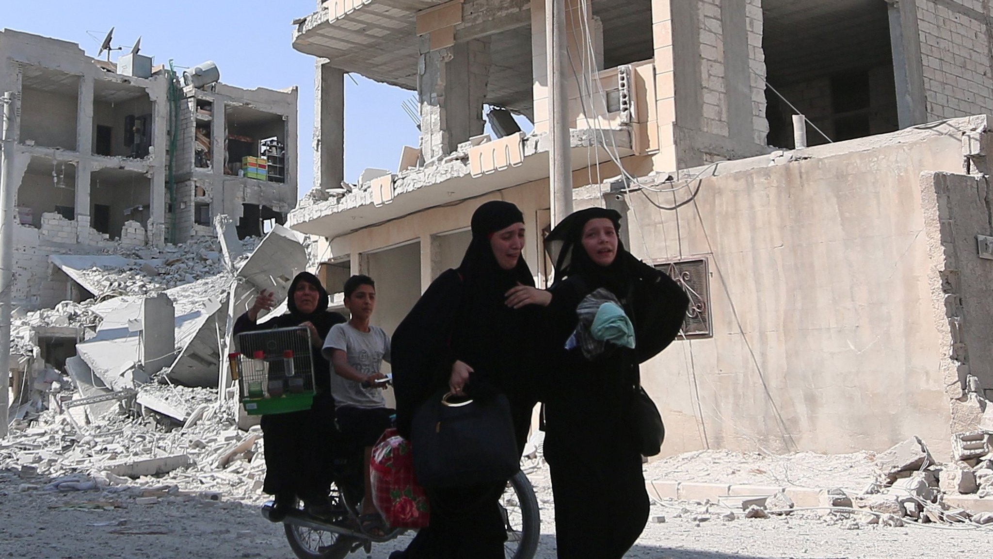 Burqas and beards off as Syrian city freed