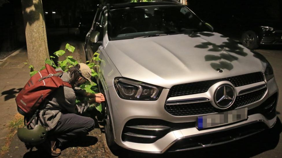 Activists deflate SUV tyres in climate protest